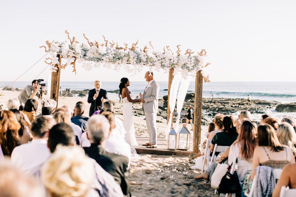 bride and groom getting married on the beach 