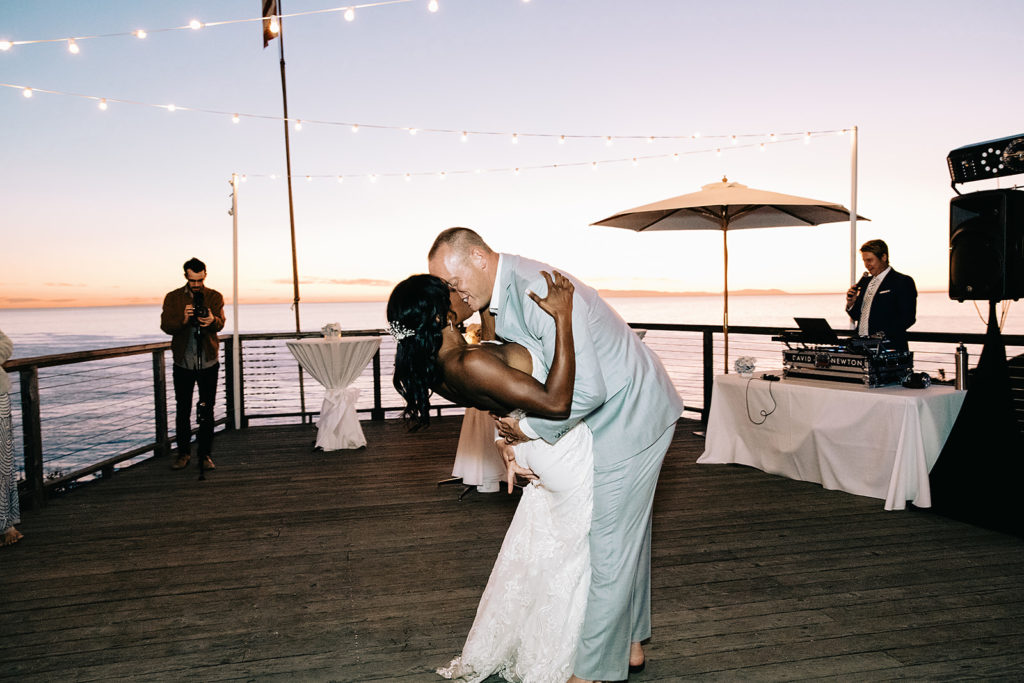 bride and groom first dance on the beach